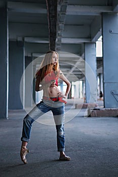 Ballerina dancing with cup of coffee. Street performance.