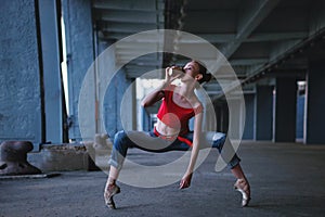 Ballerina dancing with cup of coffee. Street performance.