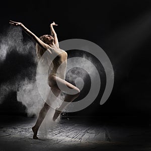 Ballerina dancing with flour