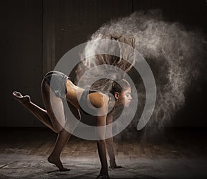 Ballerina dancing with flour