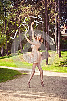 Ballerina dancing in the park