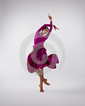 Ballerina dancing in pink flying dress