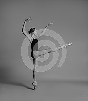 A ballerina is dancing in the studio