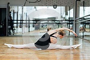 Ballerina doing stretching exercises