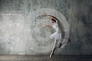 Ballerina female. Young beautiful woman ballet dancer, dressed in professional outfit, pointe shoes and white tutu.