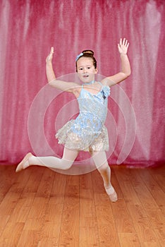 Ballerina girl dancing and jumping