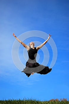 Ballerina jumping midair photo