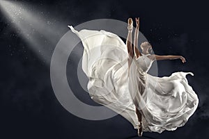 Ballerina Jumping in White Silk Dress, Modern Ballet Dancer in Pointe Shoes, Fluttering Waving Cloth, Gray Background