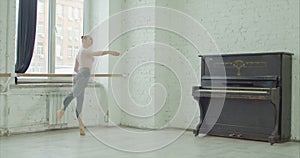 Ballerina performing battement frapper exercise