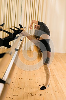 Ballerina in pointe pose. Beautiful ballet dancer stretching in class. Ballerina woman training photo