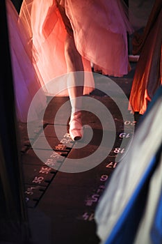 Ballerina in pointe shoes behind the scenes