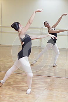 Ballerina posing in the mirror