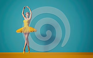 Ballerina posing in a yellow skirt