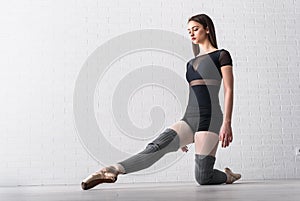 Ballerina practicing on the floor of her art studio