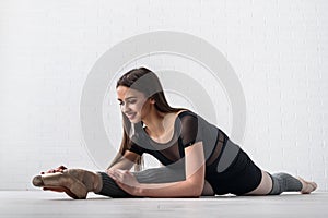 Ballerina practicing on the floor of her art studio