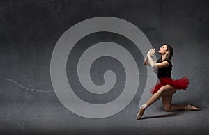 Ballerina praying with hands clapsed