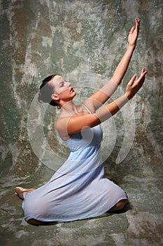 Ballerina with raised hands