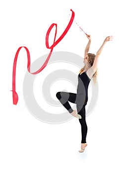 Ballerina with ribbon stands and raises hands