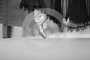 Ballerina`s feet in pointe shoes