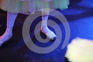 Ballerina`s feet in pointe shoes