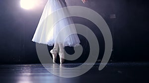 Ballerina`s legs in pointe shoes. No face. Close-up. HD.