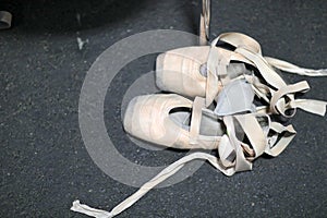 Ballerina`s rehearsal ballet shoes with ribbons and rubber bands