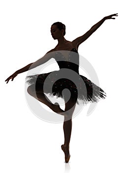 Ballerina silhouette making ballet pirouette against white background