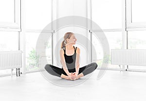 Ballerina sitting in training hall