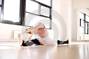 Ballerina Splitting Legs While Reaching her Toes