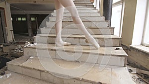 A ballerina trains in an abandoned building