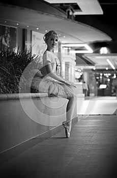 Ballerina in an urban nighttime setting