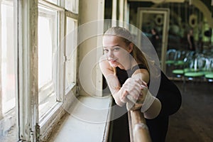 Ballerina warming up in ballet class