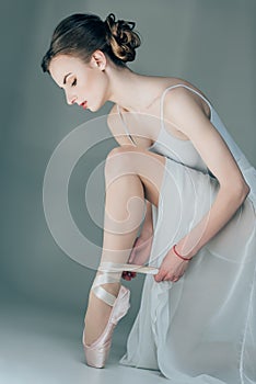 ballerina wearing ballet shoes on feet