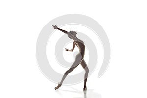 Ballerina. Young graceful female ballet dancer dancing isolated on white. Beauty of classic ballet.