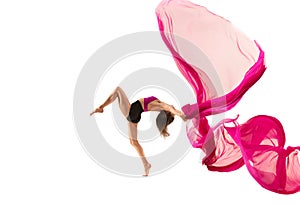 Ballerina. Young graceful female ballet dancer dancing over white studio. Beauty of classic ballet.