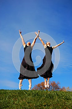 Ballerinas dancing in field