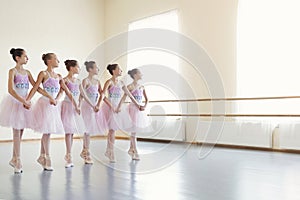 Ballerinas rehearsing dance of little swans in class