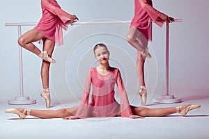 Ballerinas stretching on the bar