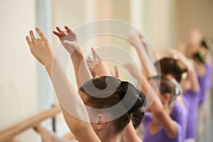 Ballerinas training at class, cropped image.