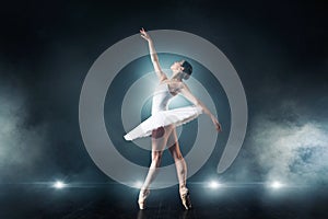 Ballet dancer dancing on the stage in theatre