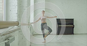 Ballet dancer doing battement fondu exercise
