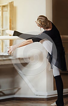 Ballet dancer exercising at the barre