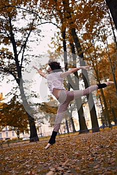 Ballet dancer jump in a garden the city of St. Petersburg