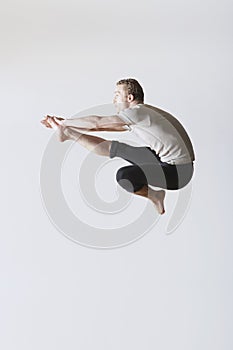 Ballet Dancer Jumping Over White Background