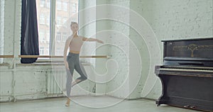 Ballet dancer performing failli jump exercise