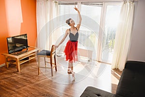 Ballet dancer stretch and dance at home