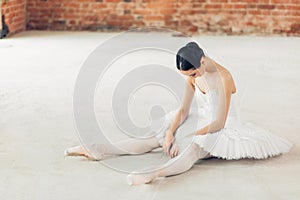 Ballet dancer is tired after working out.