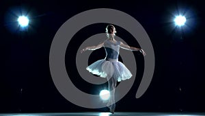 Ballet dancer in white tutu on a blue