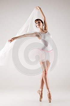 Ballet dancer in white tutu posing
