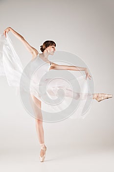 Ballet dancer in white tutu posing